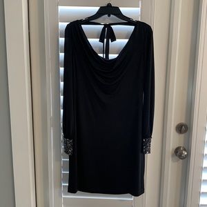 Black, long sleeve cocktail dress. Embellished cuffs. Size 10.